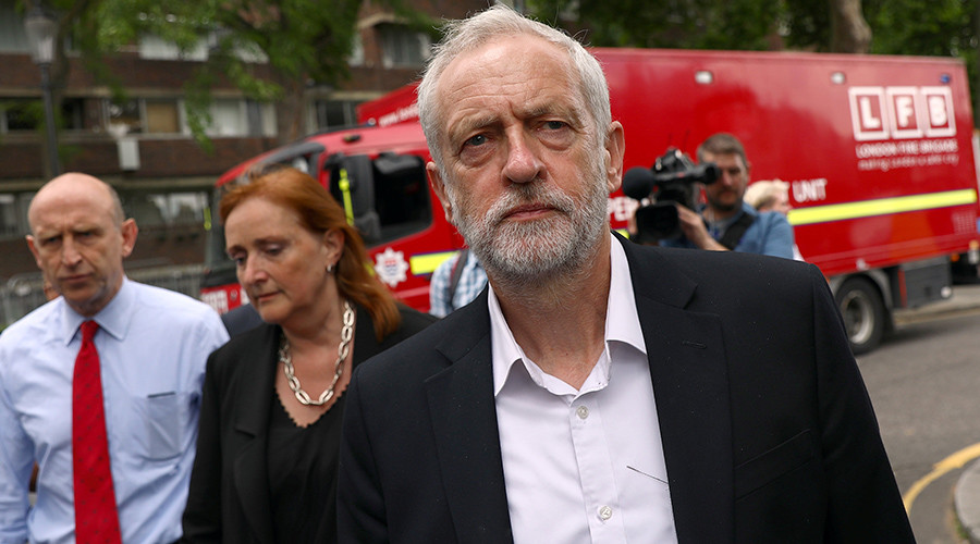May & Corbyn visit site of London tower fire, but PM avoids talking to survivors