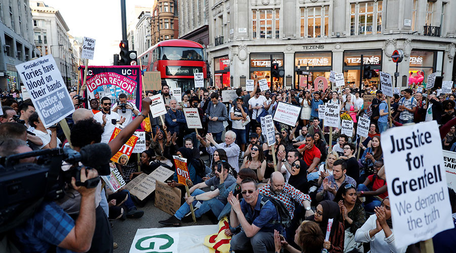 Ruptly producer attacked & violently kicked at Grenfell fire protest in London