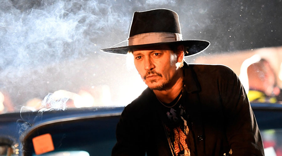 Johnny Depp plays the fool, jokes about Trump assassination