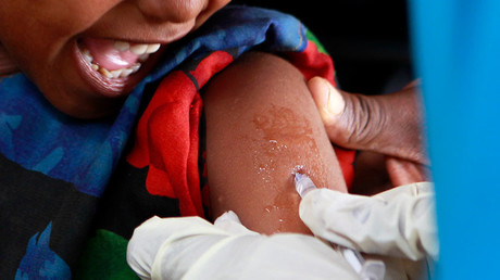 A child is immunized against the measles © Thomas Mukoya 