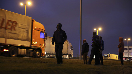 FILE PHOTO: Migrants stand near a road, Calais. © Pascal Rossignol