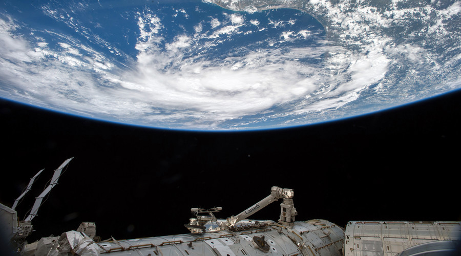 Mystery surrounds objects spotted near satellite as contact finally restored