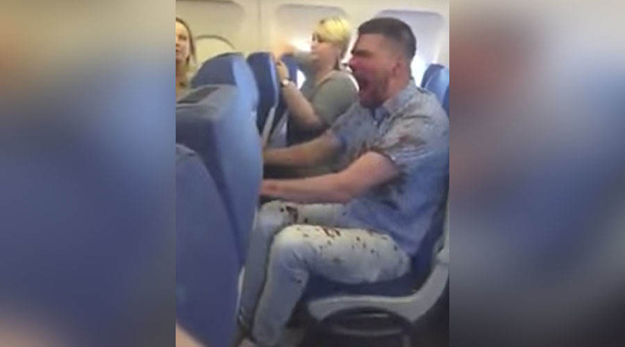 Bloodied man tied up by passengers after fear of flying leads to extreme drunkenness (VIDEOS)