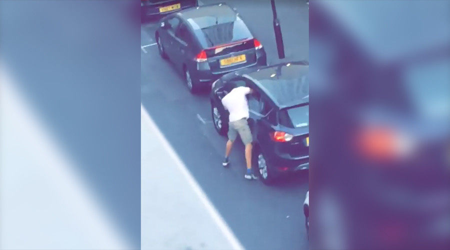 Masked attacker lunges through car window and violently stabs driver (VIDEO)