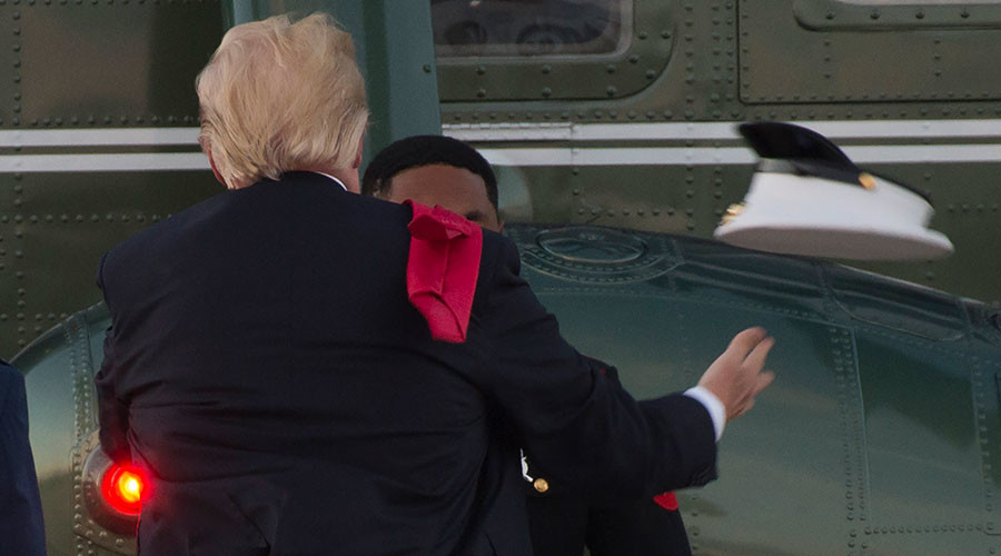 Trump struggles with Marine’s hat on windy helicopter pad (VIDEO)