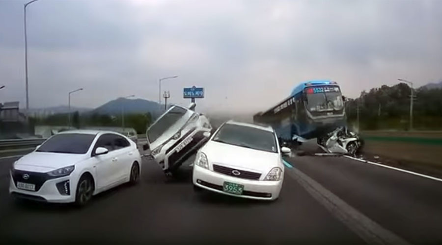 Out-of-control bus crushes car in horrific motorway pile-up (VIDEO)