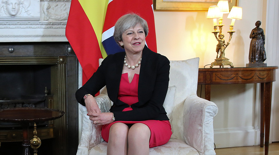 Romanian journalist confronts awkward Theresa May over Brexit at swanky party (VIDEO)