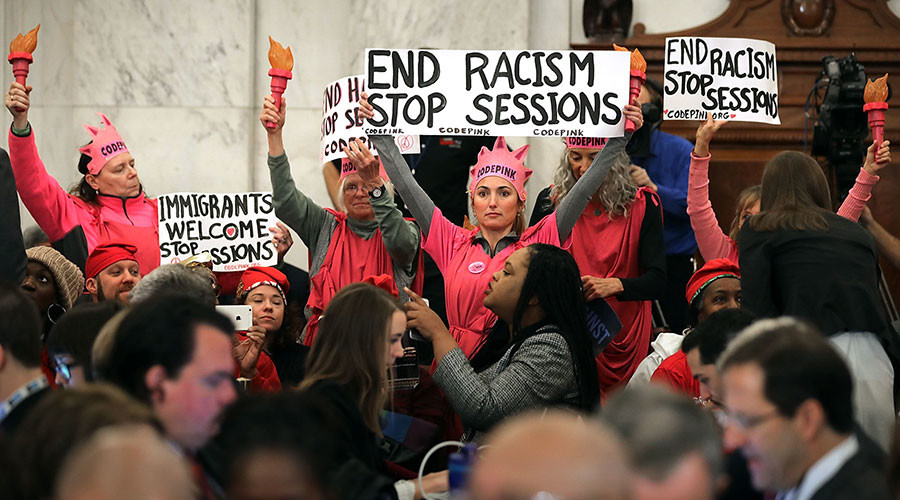 Judge tosses out jury conviction of protester who laughed at Jeff Sessions