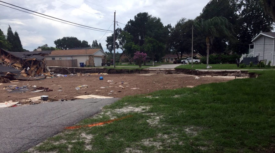 Enormous sinkhole devours two homes, threatens Florida neighborhood