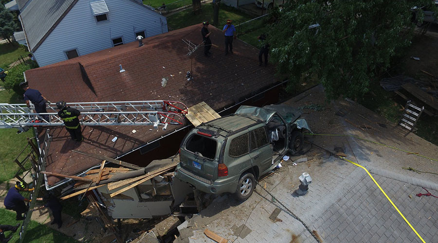 Homeowner cheats death as SUV crashes into his roof (VIDEOS, PHOTOS)