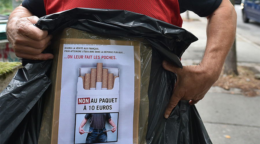 French tobacconists protest govt plan to raise cigarette prices