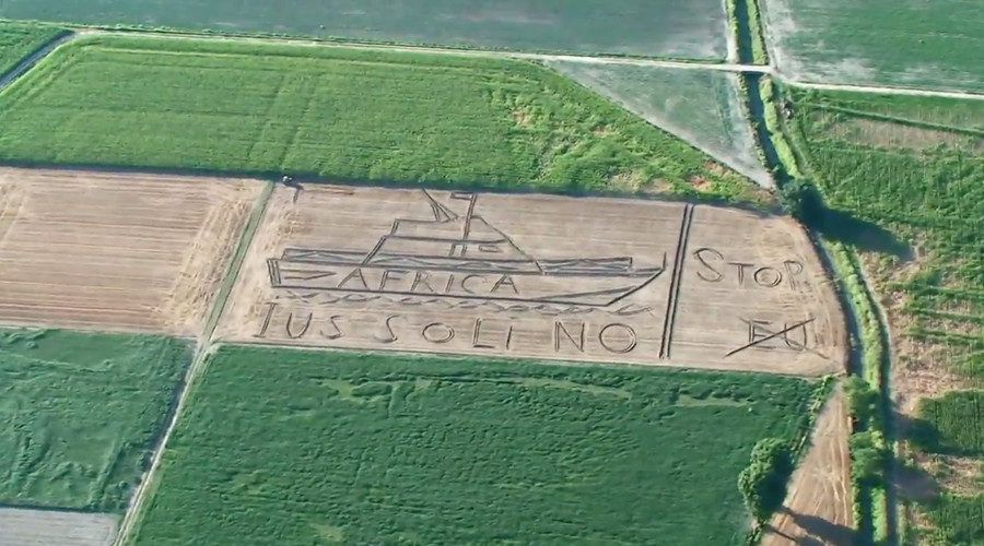 'Stop, EU': Giant anti-migrant message ploughed into Italian field (VIDEO)