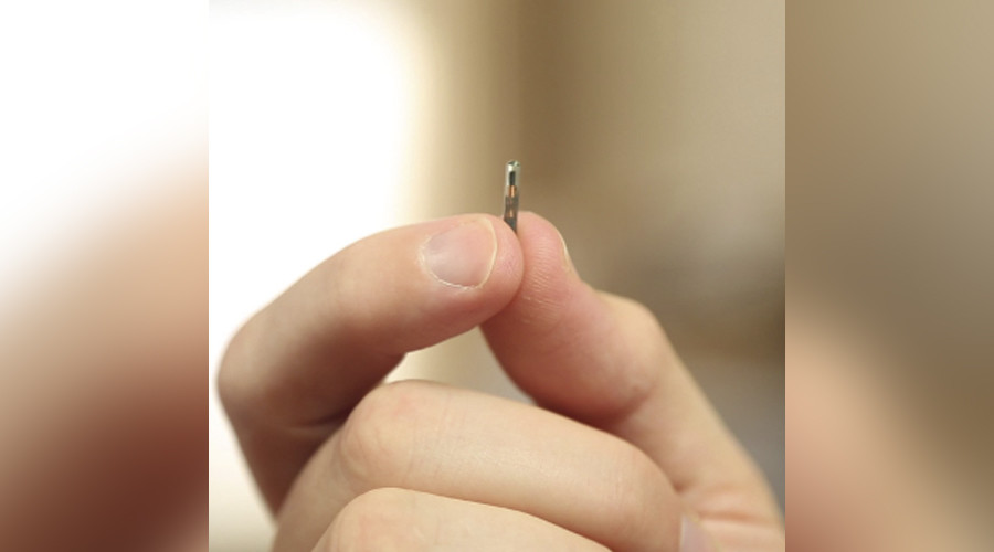 Handy way to pay: US firm plans to fit employees with microchip implants