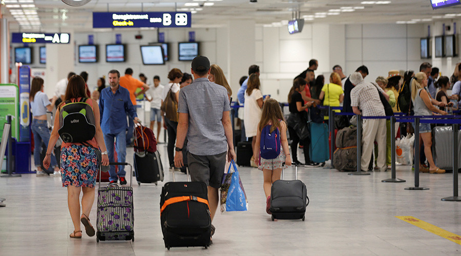 Airport staffer suspended after ‘punching passenger holding child’ (PHOTOS)
