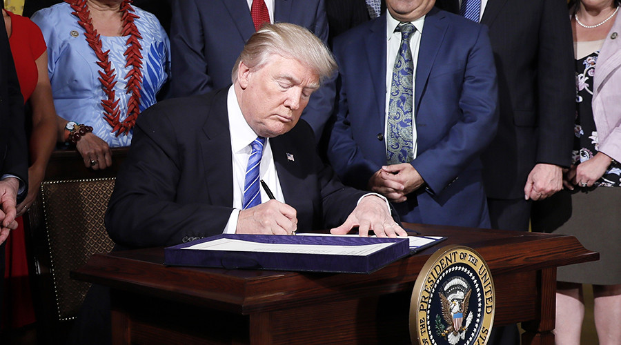 Trump signs Russian sanctions bill into law