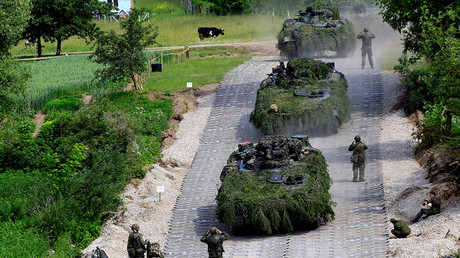 German Army Leopard tanks cross the Neris river during the 2017 Iron Wolf exercise in Stasenai, Lithuania, June 20, 2017. © Ints Kalnins