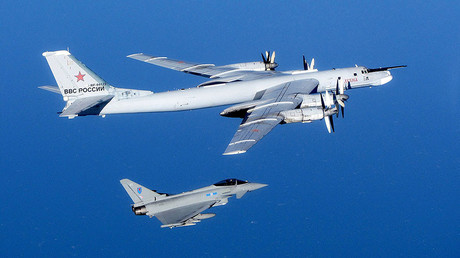 A Russian Tu-95 Bear bomber aircraft is escorted by a Royal Air Force Quick Reaction Alert (QRA) Typhoon during an intercept in September 2014 in the UK's Northern airspace. © RAF / Global Look Press
