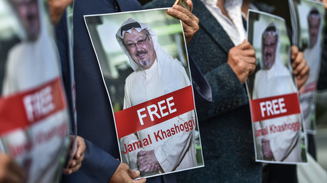 FILE PHOTO Protesters hold pictures of missing journalist Jamal Khashoggi in front of the Saudi Arabian consulate in Istanbul © AFP / Ozan Kose