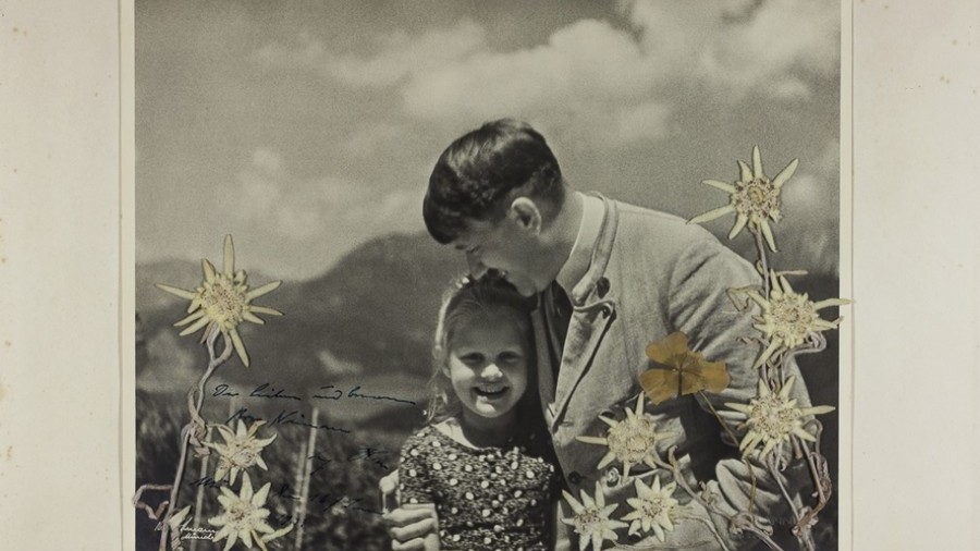 ‘Fuehrer’s child’: Stunning photo of Hitler hugging Jewish girl goes on sale in US