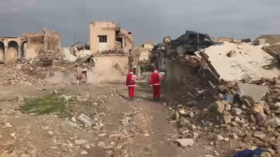 Christmas in ruins: Santas barely find kids to hand presents to in devastated Mosul (VIDEO)