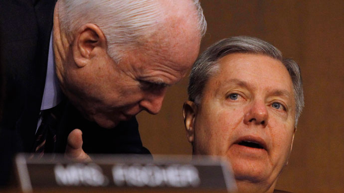 Senators John McCain (R-AZ) (L) and Lindsey Graham (R-SC) (R) confer at the Senate Armed Services Committee in Washington March 5, 2013.(Reuters / Gary Cameron)