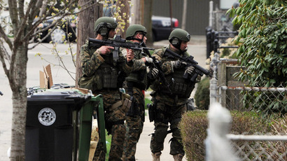 Police conduct a door-to-door search for 19-year-old Boston Marathon bombing suspect Dzhokhar A. Tsarnaev on Francis Street April 19, 2013 in Watertown, Massachusetts. (Darren McCollester/Getty Images/AFP)