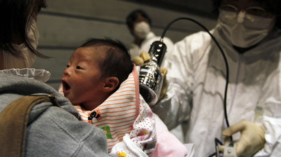 Nagashima Rio who was born on March 15, is tested for possible nuclear radiation at an evacuation centre in Koriyama, Fukushima Prefecture, northern Japan, located about 60 km from the tsunami and earthquake-crippled nuclear reactor, March 31, 2011. (Reuters/Kim Kyung-Hoon)