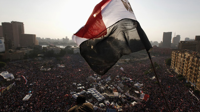 An Egyptian flag is seen as protesters opposing Egyptian President Mohamed Morsi shout slogans against him and Brotherhood members during a protest at Tahrir Square in Cairo June 30, 2013 (Reuters/Mohamed Abd El Ghany) 