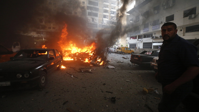 Residents gather at the site of an explosion in Beirut's southern suburb neighbourhood of Bir al-Abed on July 9, 2013 (AFP Photo / Str)