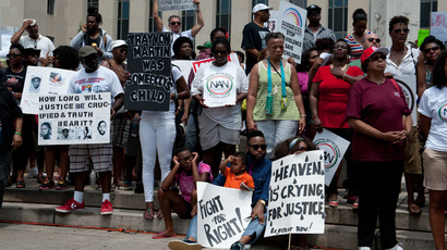 People demonstrate in Washington on July 20, 2013, one week after the acquittal of George Zimmerman (AFP Photo / Nicholas Kamm) 