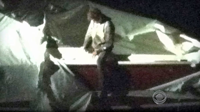 Сourtesy CBS News shows Dzhokhar Tsarnaev, a suspect in the Boston Marathon bombing who was captured Friday night, April 19, 2013 after he was found hiding in a boat in a Boston suburb.(AFP Photo / CBS News)