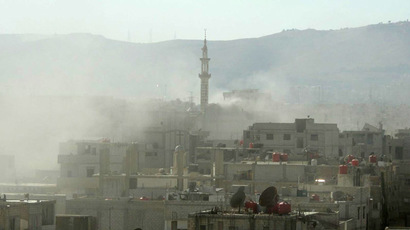 A handout image released by the Syrian opposition's Shaam News Network shows smoke above buildings following what Syrian rebels claim to be a toxic gas attack by pro-government forces in eastern Ghouta, on the outskirts of Damascus on August 21, 2013.  (AFP Photo/Shaam News Network)
