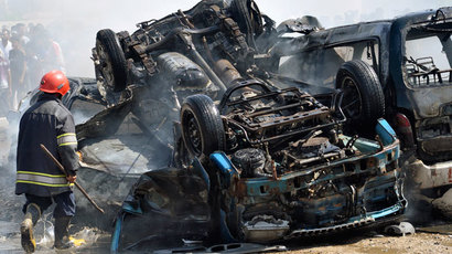 An Iraqi firefighter walks at the site of a bomb attack in Nasiriyah city, 375 km (233 miles) south of Baghdad, September 15, 2013.(Reuters / Stringer)