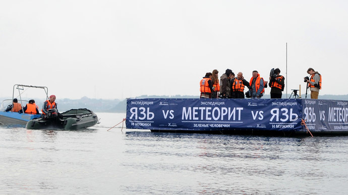 Divers raising half-ton sunken fragment of Russian meteorite