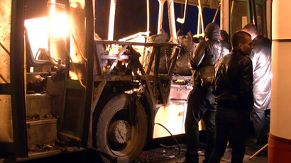 Volgograd police work inside a passenger bus blown up Monday afternoon by a female suicide bomber (RIA Novosti/
Irina Il'icheva)