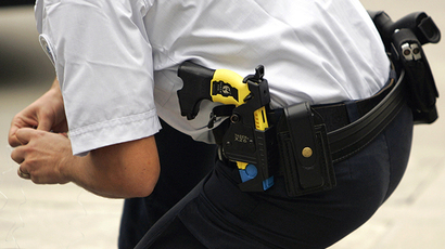 A policeman with the Taser X26 model in their holsters (AFP Photo / Jean-Pierre Muller)