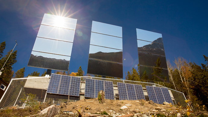 Giant mirrors erected on a mountainside reflect sunlight into the Norwegian industrial town of Rjukan (Reuters / Tore Meek / NTB Scanpix)