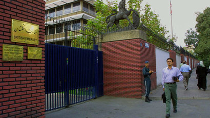 Iranians walk past the British embassy in Tehran 24 September 2001.(AFP Photo / Behrouz Mehri)