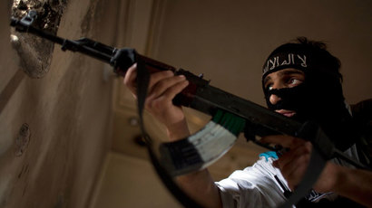 A Rebel fighter aims his weapon during fighting against Syrian government forces.(AFP Photo / Jm Lopez)