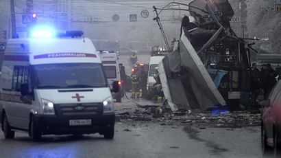 Members of the emergency services work at the site of a bomb blast on a trolleybus in Volgograd December 30, 2013. (Reuters / Sergei Karpov)