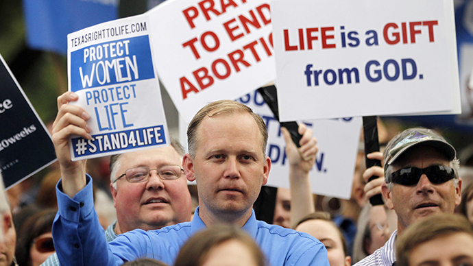 Protesters hold signs during an anti-abortion rally at the State Capitol in Austin, Texas, July 8, 2013. (Reuters / Mike Stone)