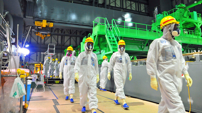This handout picture taken by the International Atomic Energy Agency (IAEA) on November 27, 2013 shows review mission members of the IAEA inspecting the crippled Tokyo Electric Power CO. (TEPCO) Fukushima Dai-ichi nuclear power plant in the town of Okuma in Fukushima prefecture. (AFP Photo/IAEA)