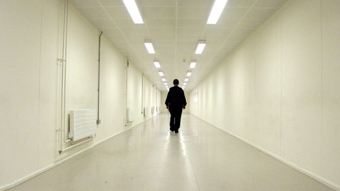 A Group 4 security officer walks down one of the corridors of Yarl's Wood Immigration Removal Centre (Reuters)