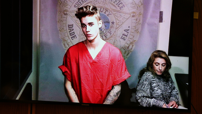 Pop singer Justin Bieber appears via video conference in his first court appearance since being arrested early morning in Miami, Florida January 23, 2014. (Reuters / Walter Michot / Pool)
