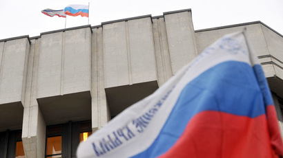Russian flags flutter atop and in front of the local parliament building in Simferopol, Crimea (AFP Photo/Genya Savilov)