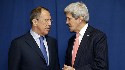 Russia's Foreign Minister Sergei Lavrov (L) and US Secretary of State John Kerry meet to discuss the Ukraine crisis on the sidelines of an International conference on Libya in Rome on March 6, 2014. (AFP Photo / Kevin Lamarque)