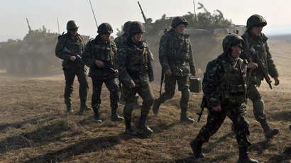  Ukrainian soldiers take part in a military drill, not far from the small city of Goncharovskoye, some 150 km from Kiev, on March 14, 2014 (AFP Photo / Sergey Supinsky)