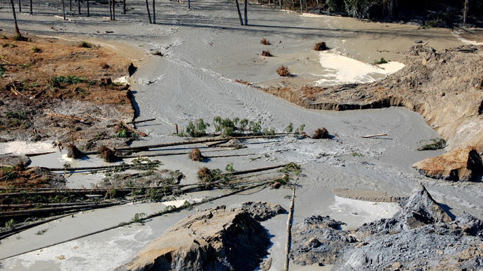 A general view of the breach where water from the Stillaguamish River is beginning to move through the dam created by a landslide near State Route 530 near Oso, Washington in this March 23, 2014 picture provided by the Washington State Department of Transportation. (Reuters/Washington State Department of Transportation)