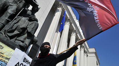 Supporters of the right wing party Pravyi Sector (Right Sector) protest in front of the Ukrainian parliament in Kiev on March 28, 2014. (AFP Photo / Ganya Savilov)