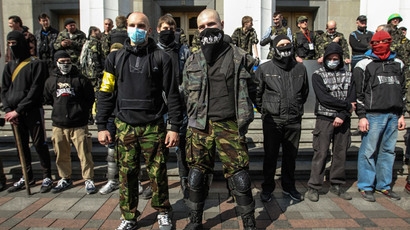 Members of the Ukrainian far-right radical group Right Sector stand outside the parliament in Kiev March 28, 2014. (Reuters / Valentyn Ogirenko)